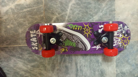Small Kids Skateboard – Purple Graphic Design with Red Wheels